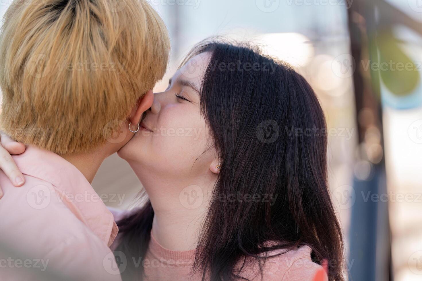 Valentine day celebration loving couple sharing a kiss outdoor setting romantic embrace soft lighting heartfelt connection photo