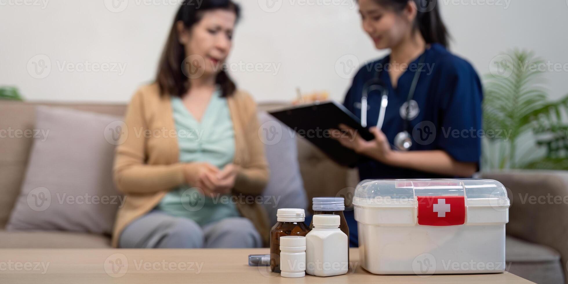 Caregiver consults elderly patient home setting medical guidance warm atmosphere compassionate approach photo