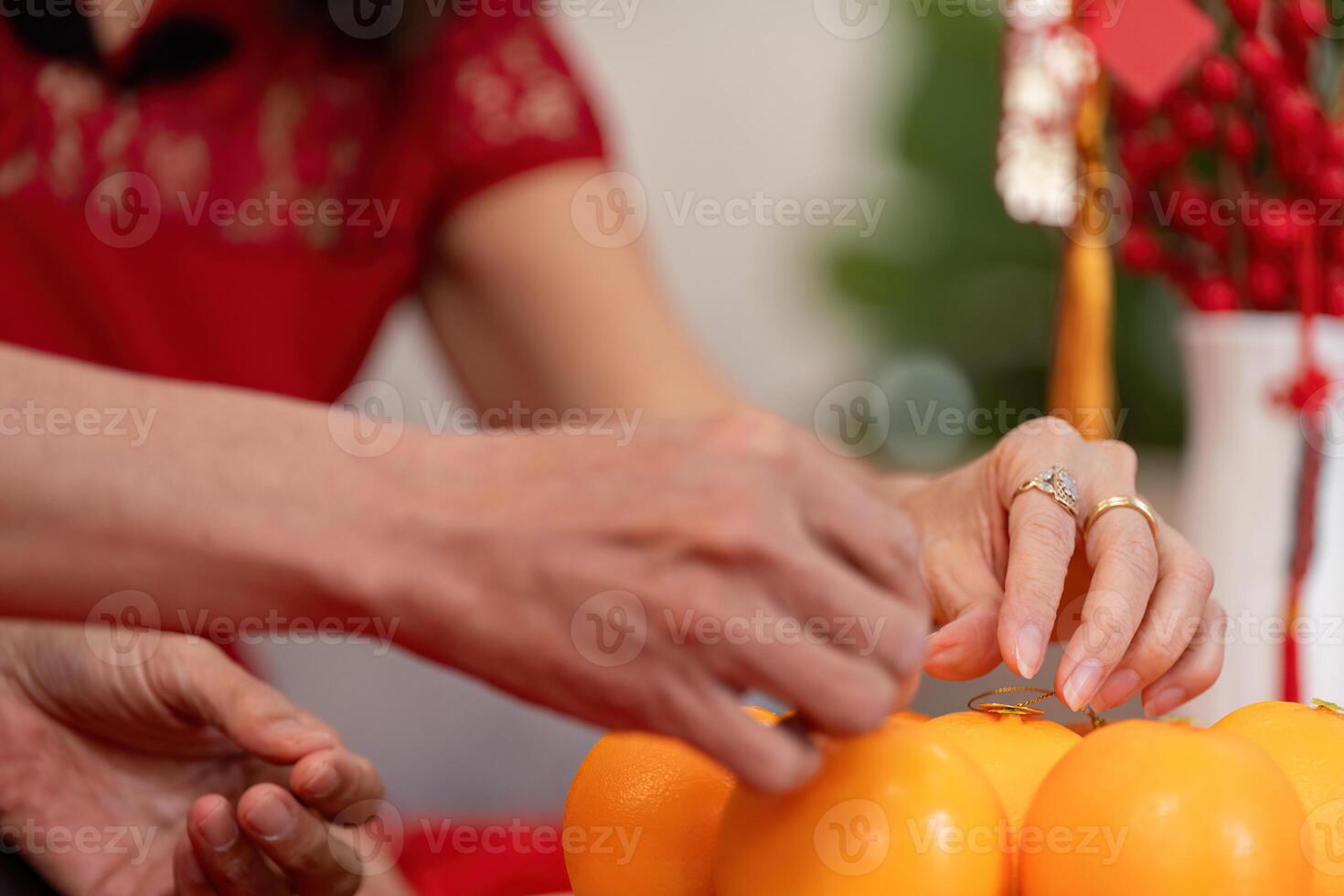 Elderly chinese couple celebrating new year traditions living room lifestyle warm atmosphere close-up view family bonding photo