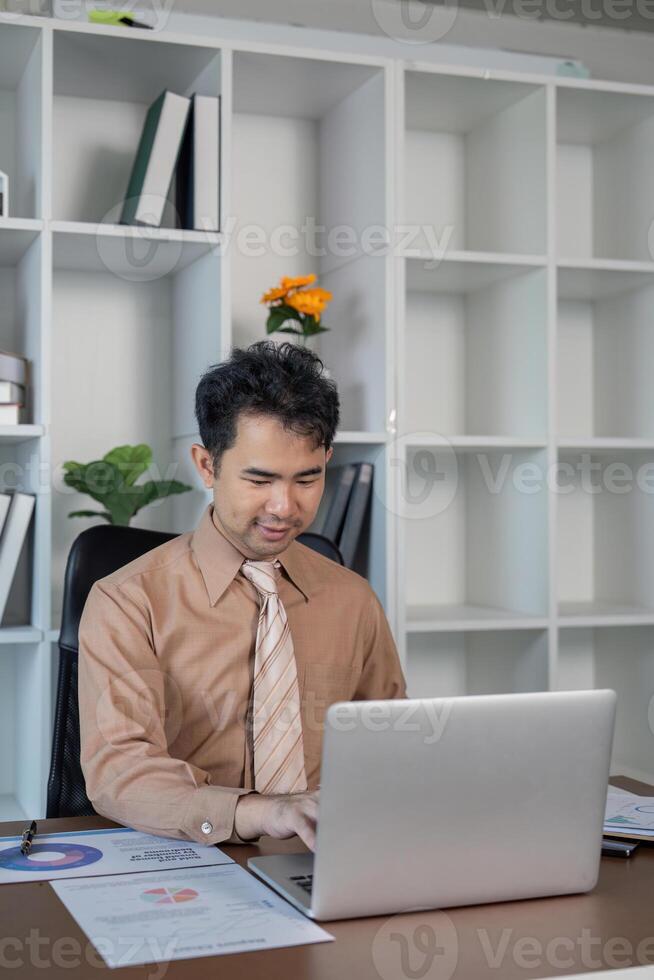 Business professional working on laptop in modern office environment business strategy indoor setting focused view photo