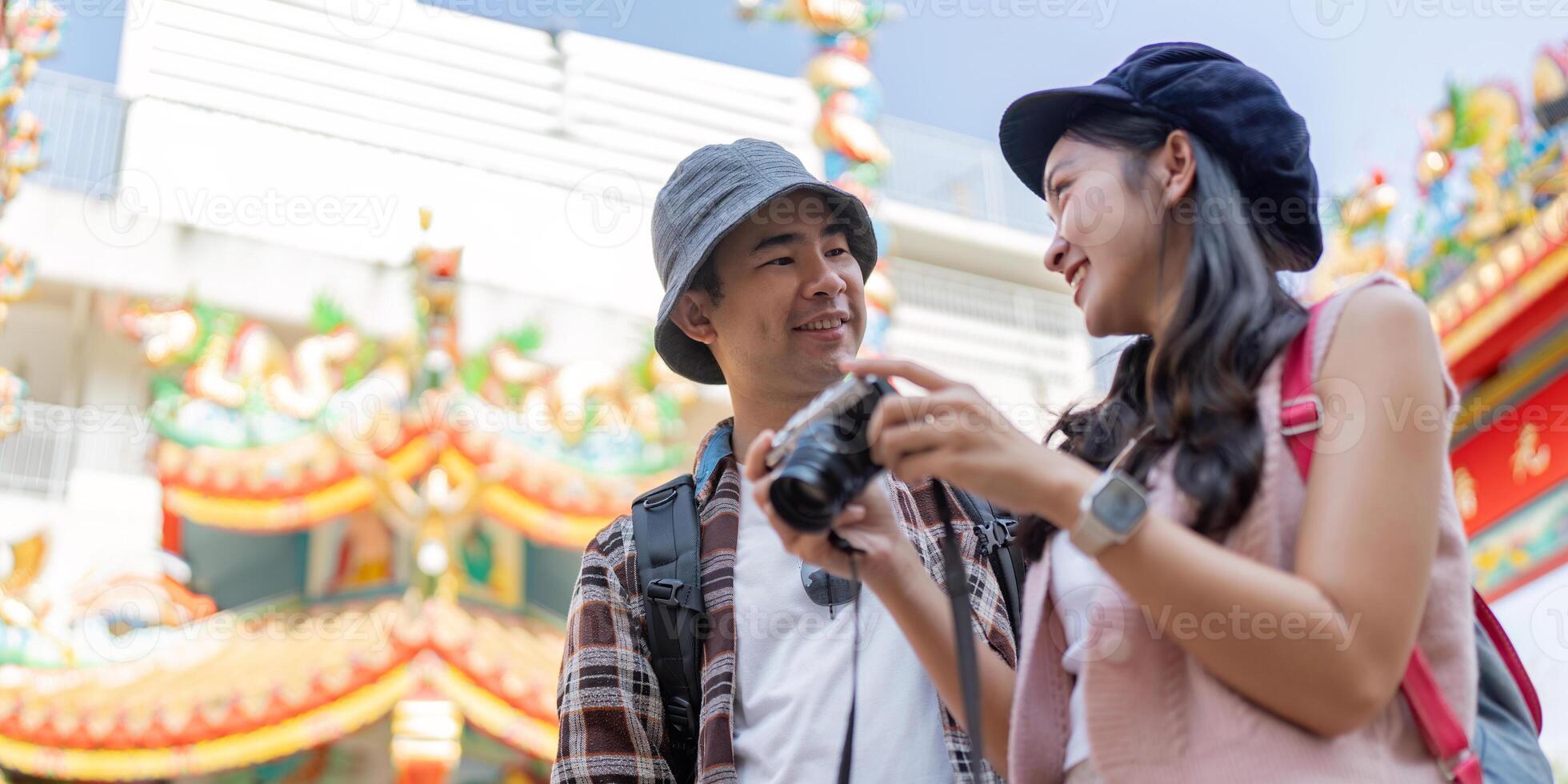 Couple traveling together with camera cultural landmark vibrant city eye level new experiences photo