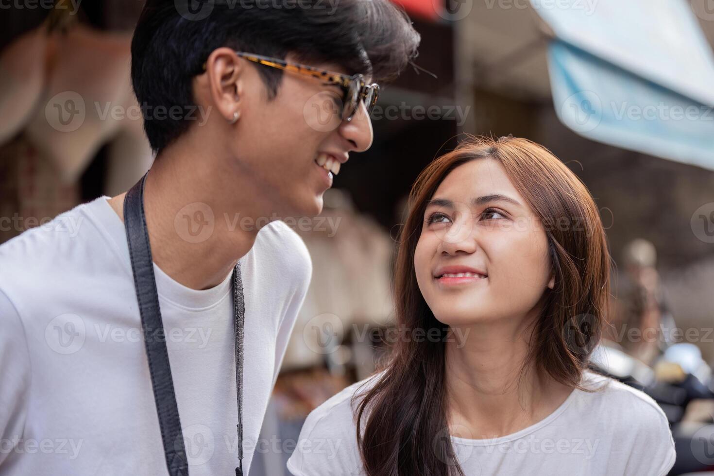 Couple traveling together in a vibrant market candid moments urban environment joyful connection photo