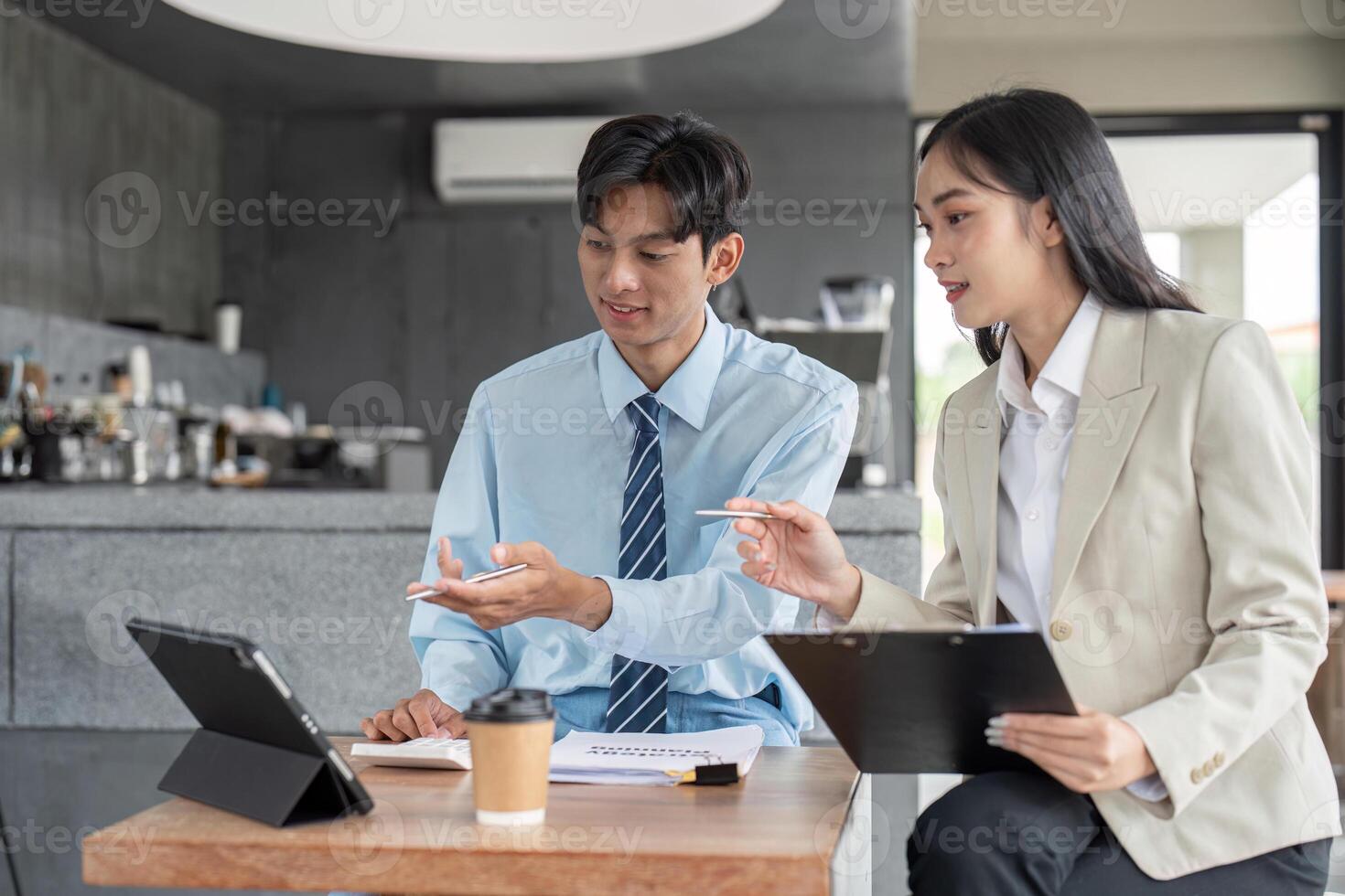 Strategic brainstorming session business team meeting over coffee modern office space collaborative ideas generation photo