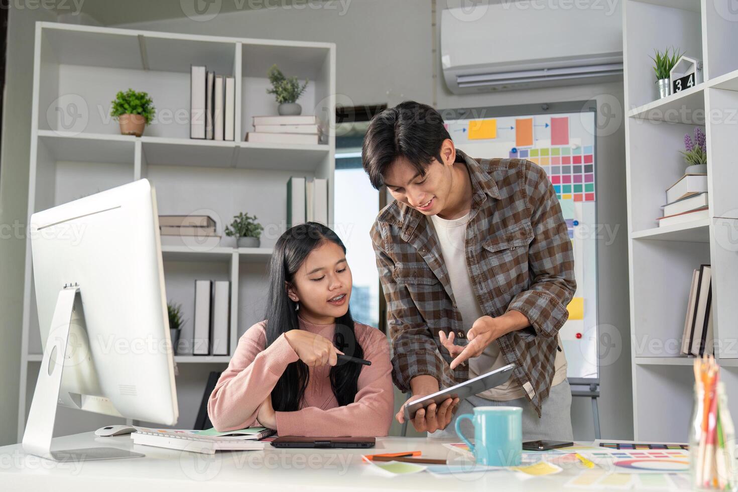 Design team meeting on color graphics and charts in a modern workspace environment photo