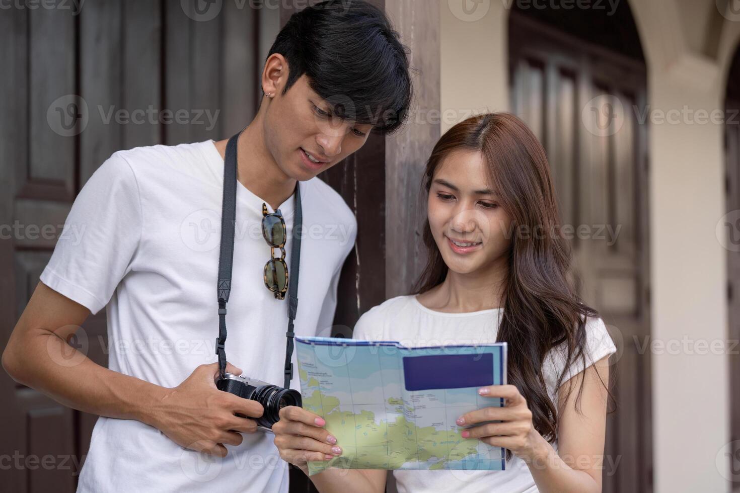 Traveling couple a map at a historic location outdoor environment engaging experience photo