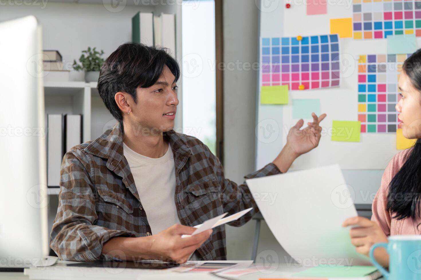 Creative design team discussing graphics strategy in modern office environment for enhanced collaboration photo