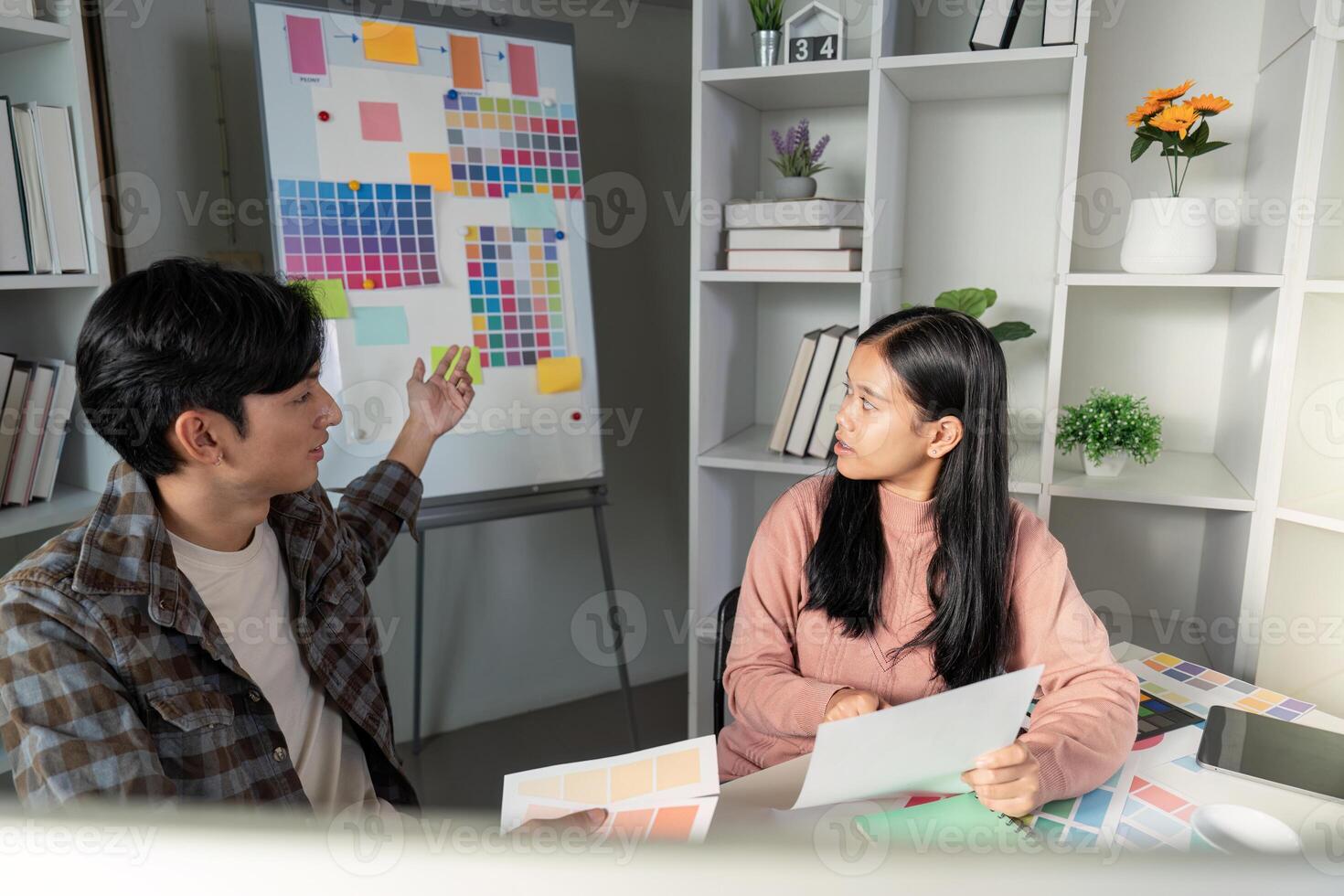 Creative team designs graphics during strategic meeting office workspace collaborative environment engaging viewpoint photo