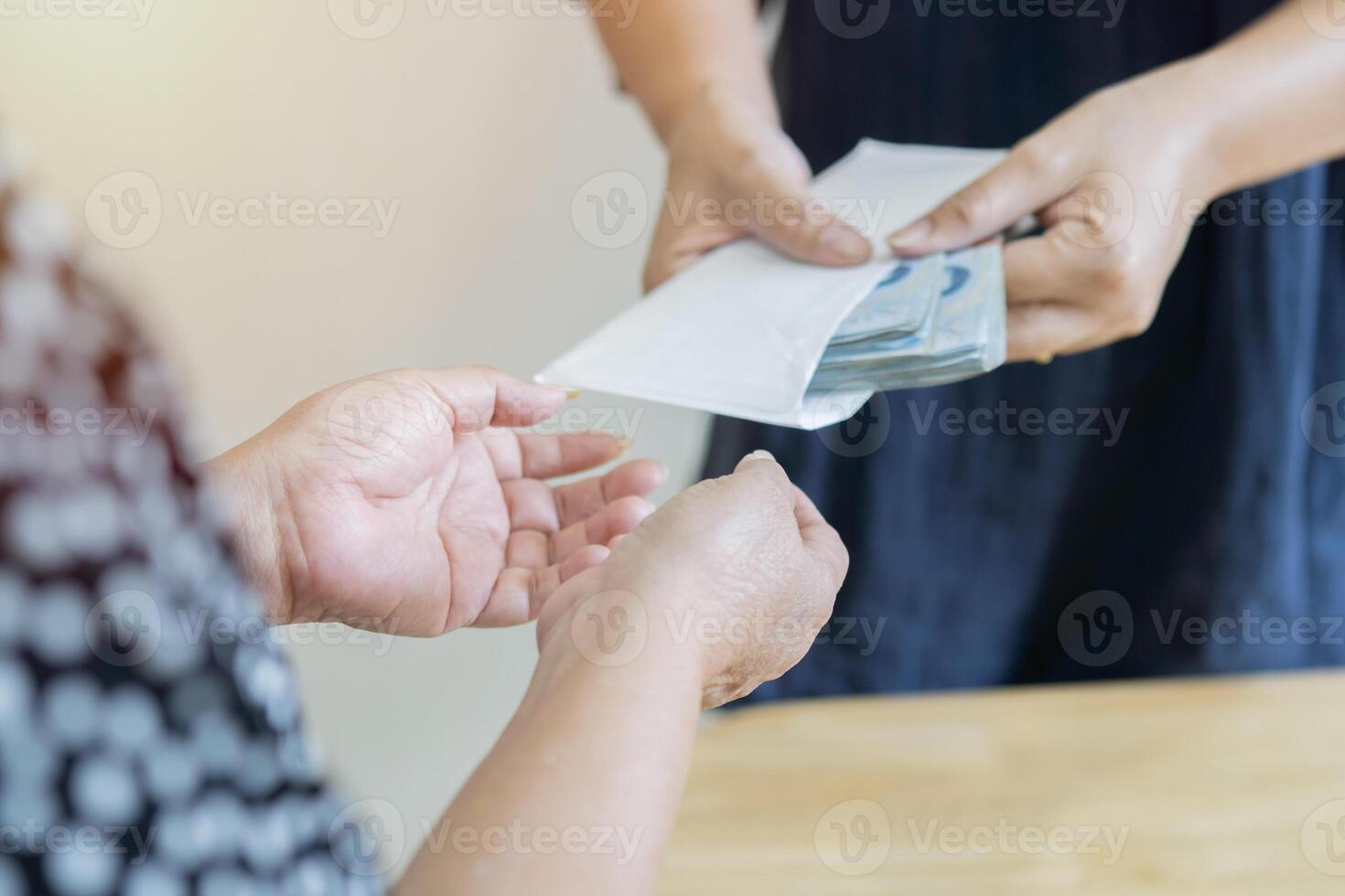 Give someone money in envelop for corruption purposes. Bribery and corruption concept. photo