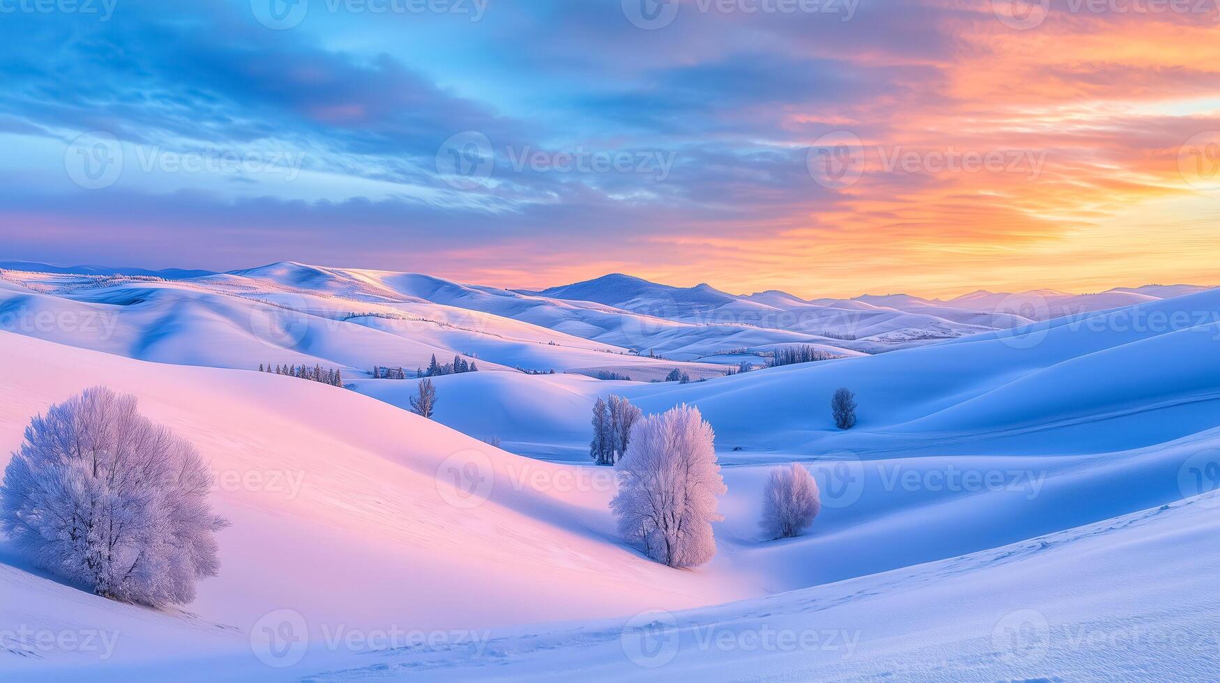 Snow covered mountains and trees at sunset photo