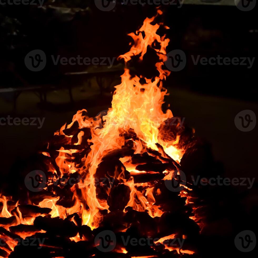 Fire flames on black background, Blaze fire flame texture background, Beautifully, the fire is burning, Fire flames with wood and cow dung bonfire photo