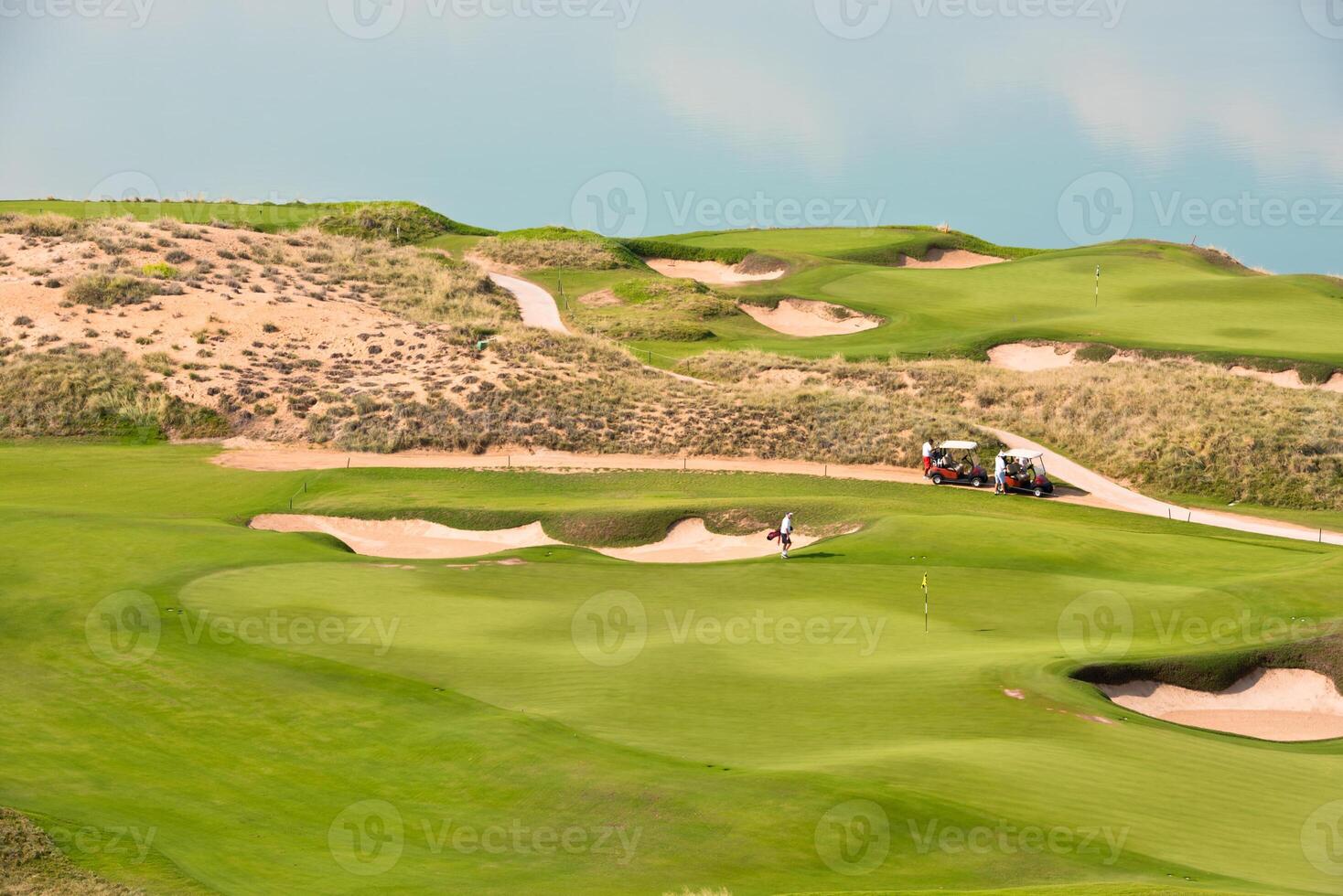 golf resort with the scenery of the sea photo