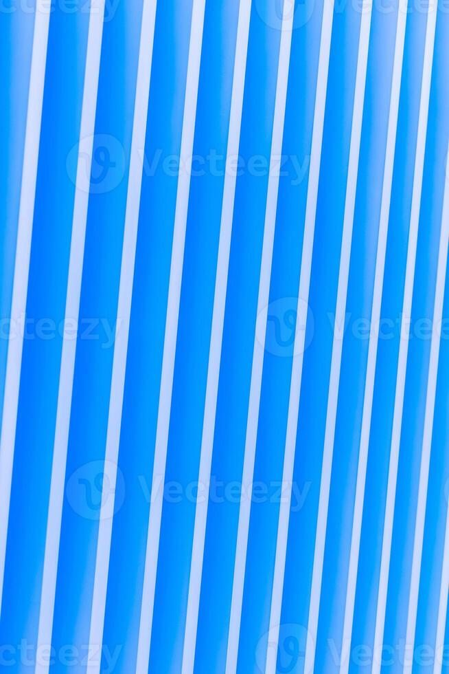 Detail of blue striped metal facade for background photo