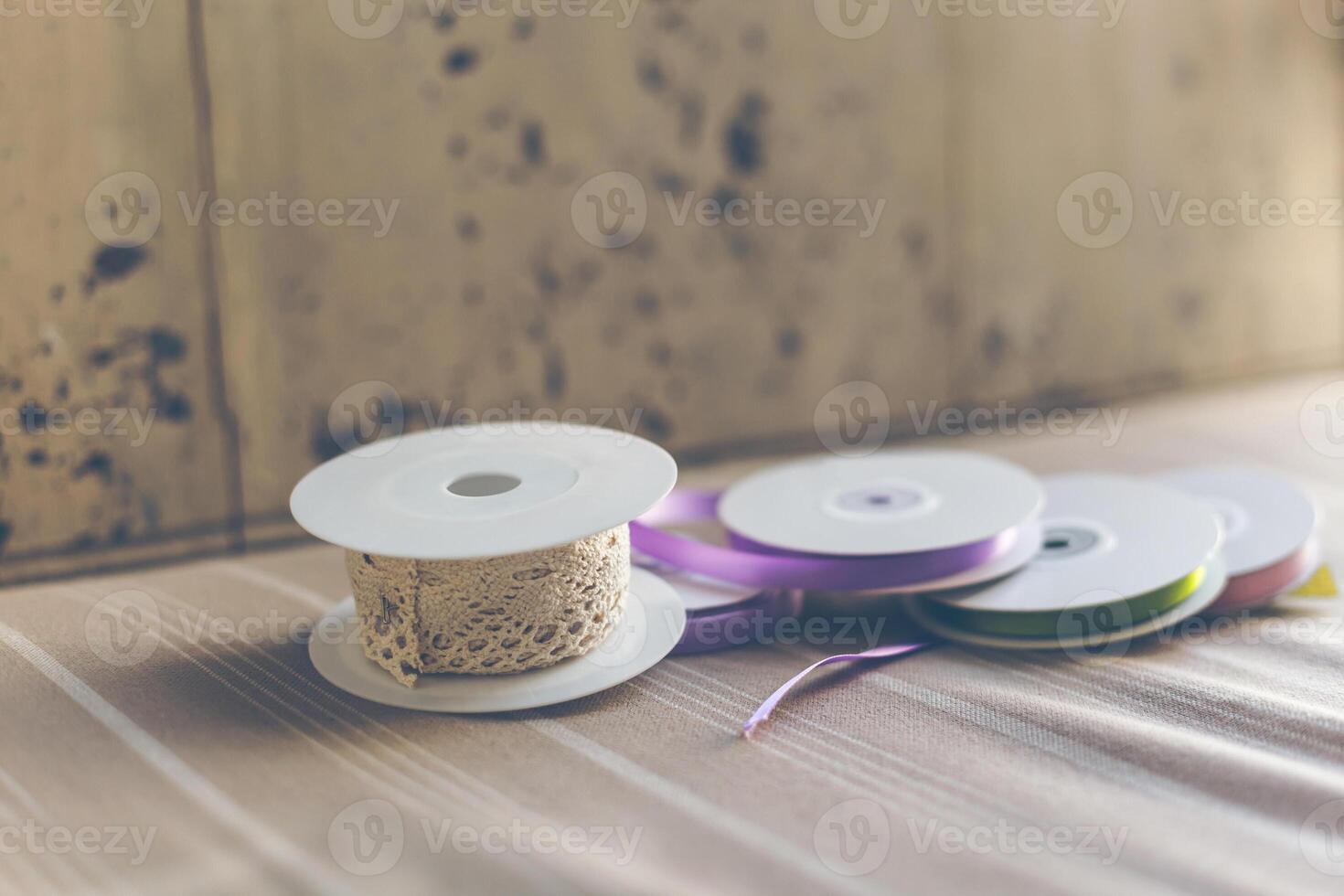 Rolls with pastel color ribbons and lace photo