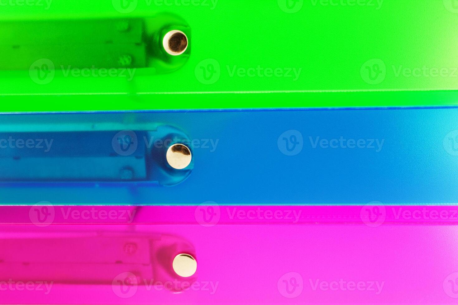 three multicolored folders photo