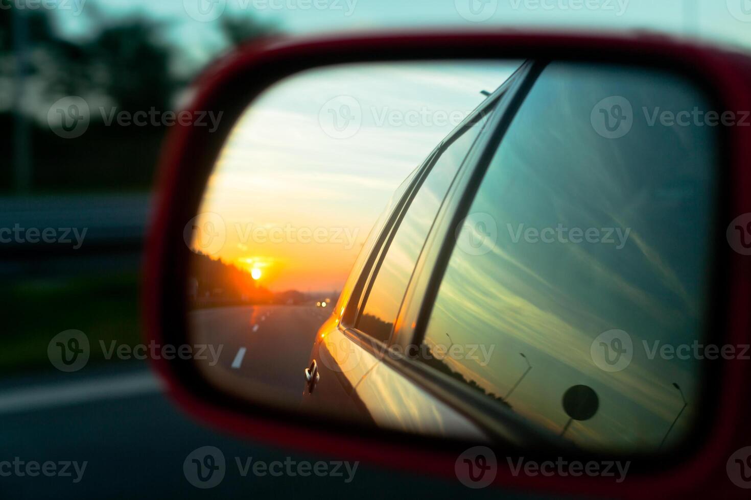 Sunset reflection in the rear view mirror photo