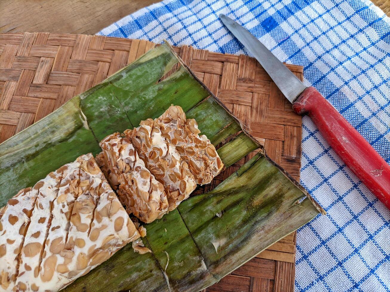 Tempe or tempeh is a typical Indonesian food made from fermented soybeans in addition to yeast or tempeh yeast. photo