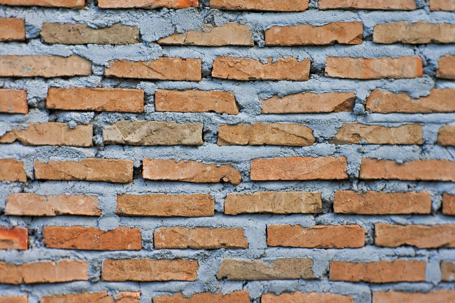 The walls of a building or house made from a pile of bricks. Background and texture concept photo