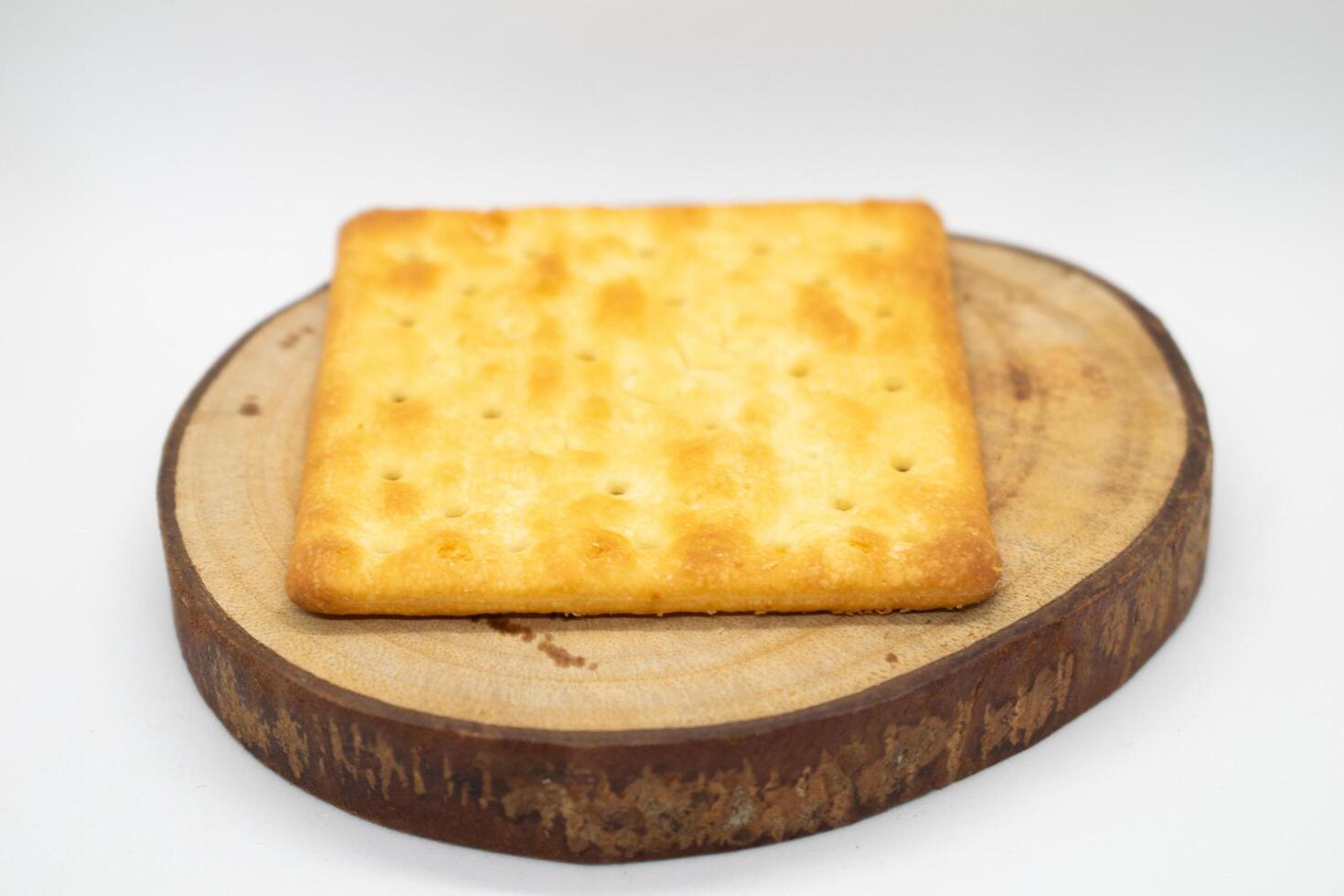 Biscuits on wood slice with white background photo