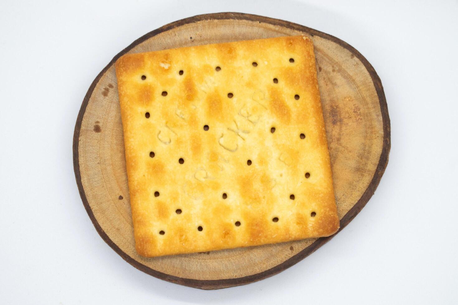 Biscuits on wood slice with white background photo