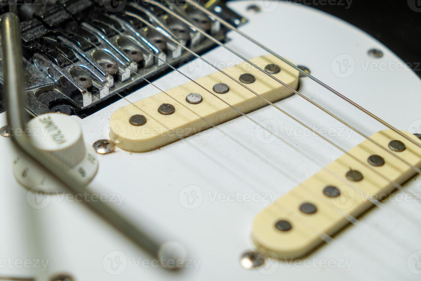 close-up detail of the strings of an electric guitar photo