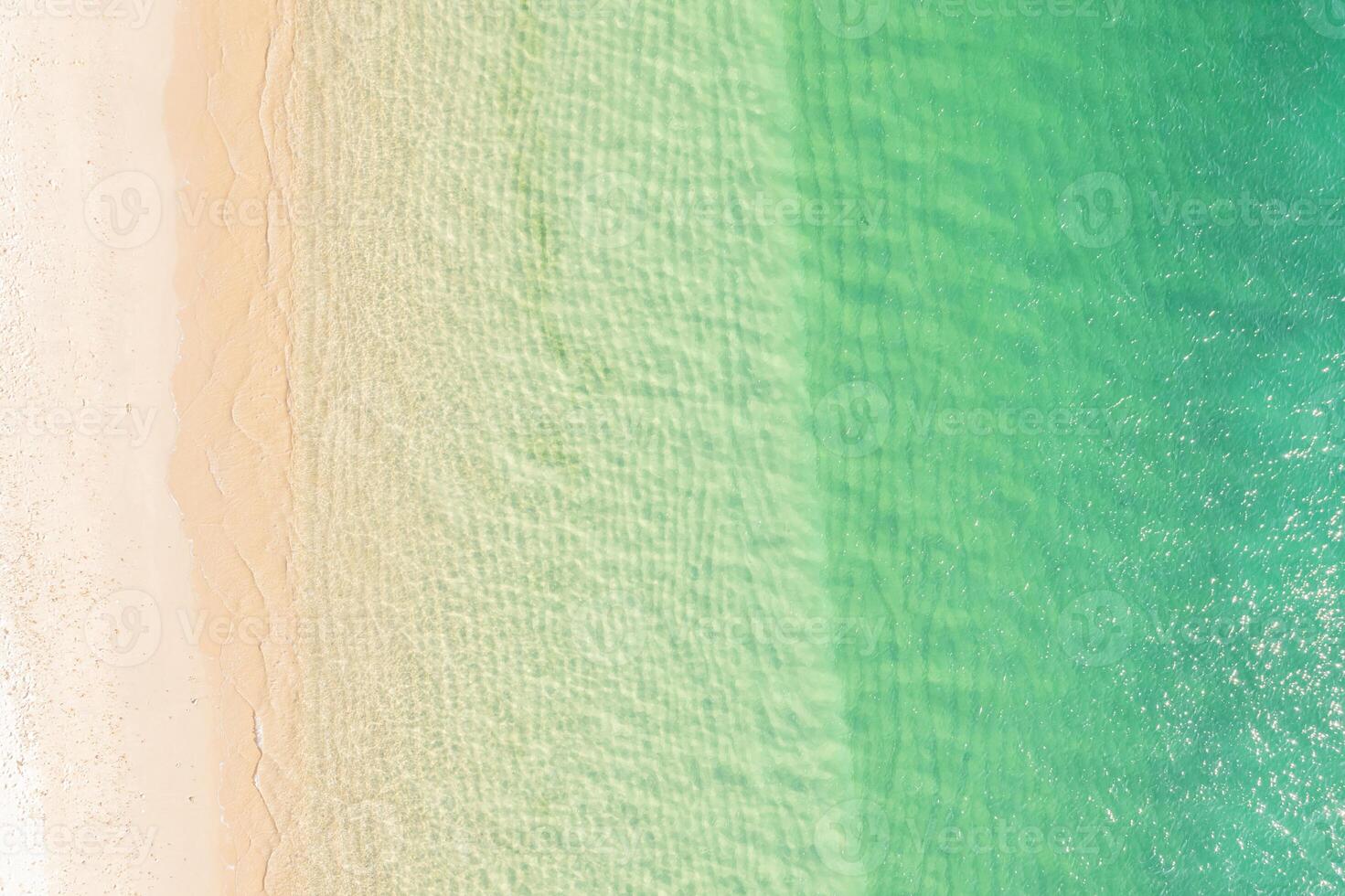 paradisiac beach of turquoise waters from a zenithal drone view. Summer concept background photo