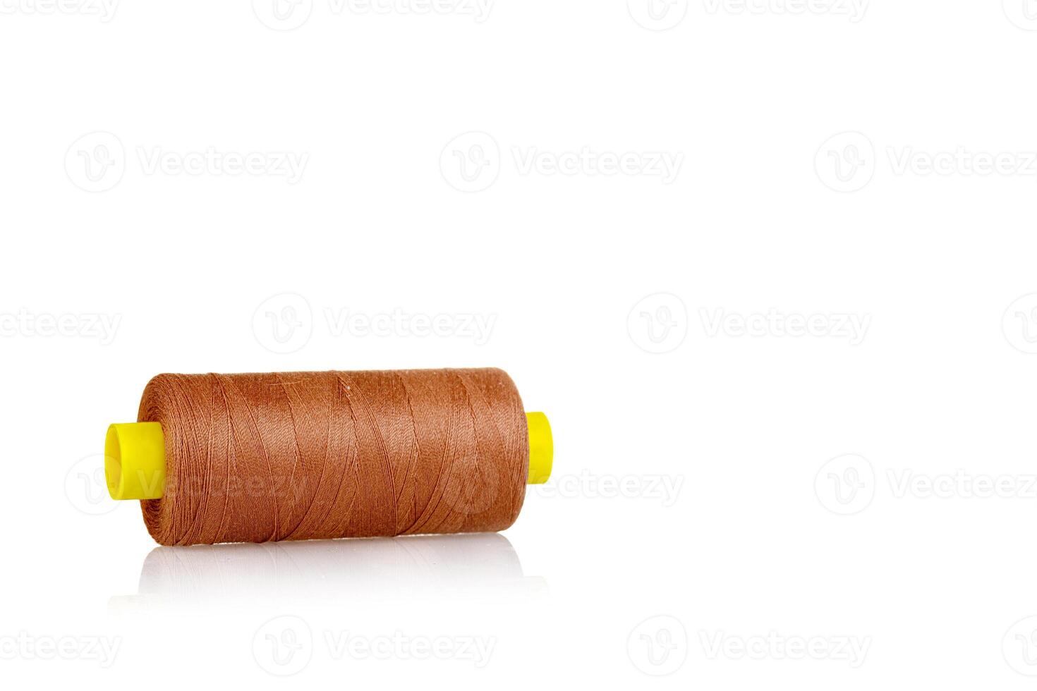 skein of thread brown colors macro on a white background photo