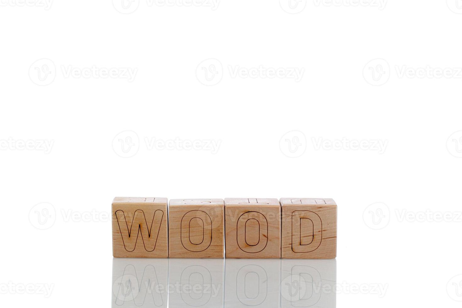 Wooden cubes with letters wood on a white background photo