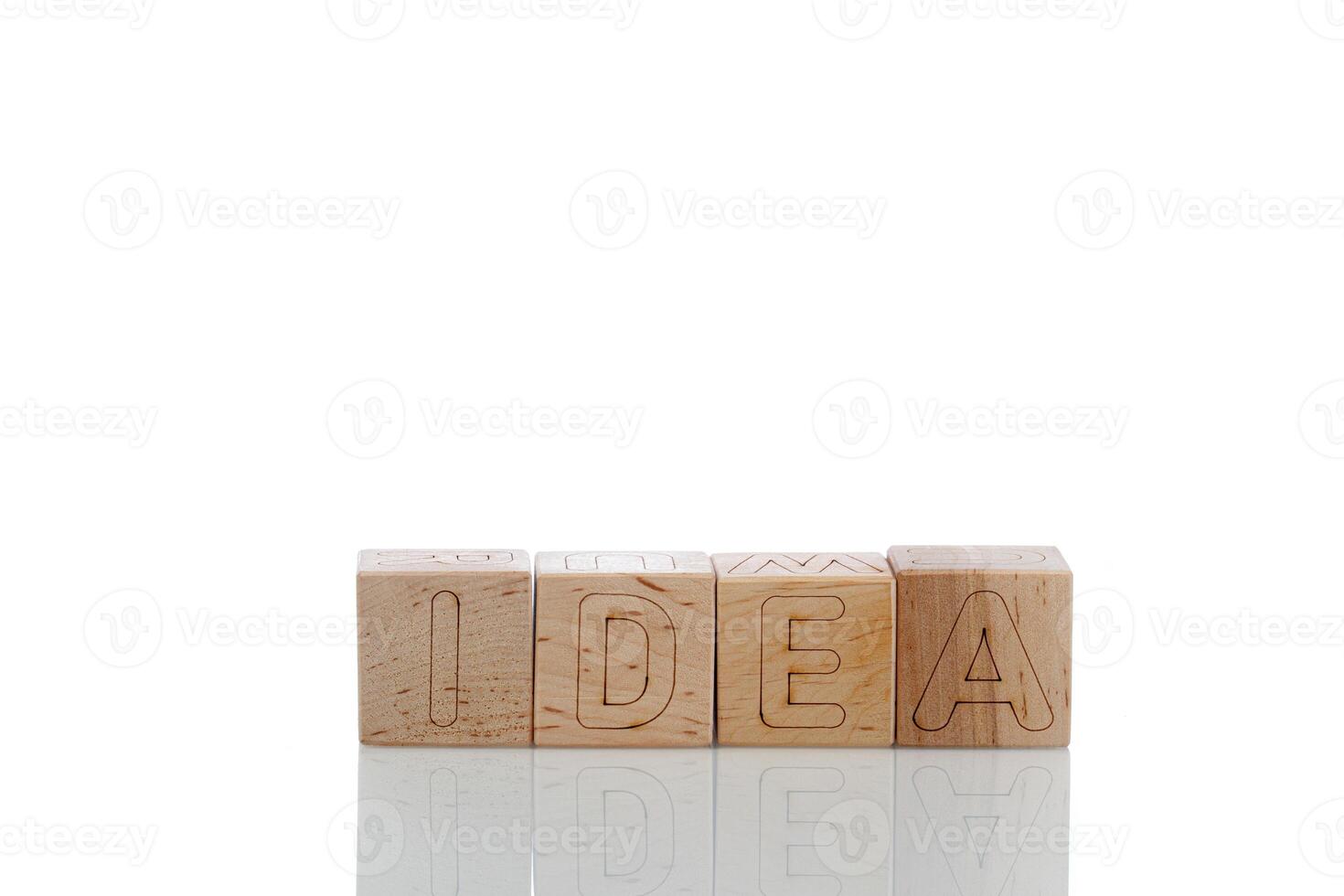 Wooden cubes with letters idea on a white background photo
