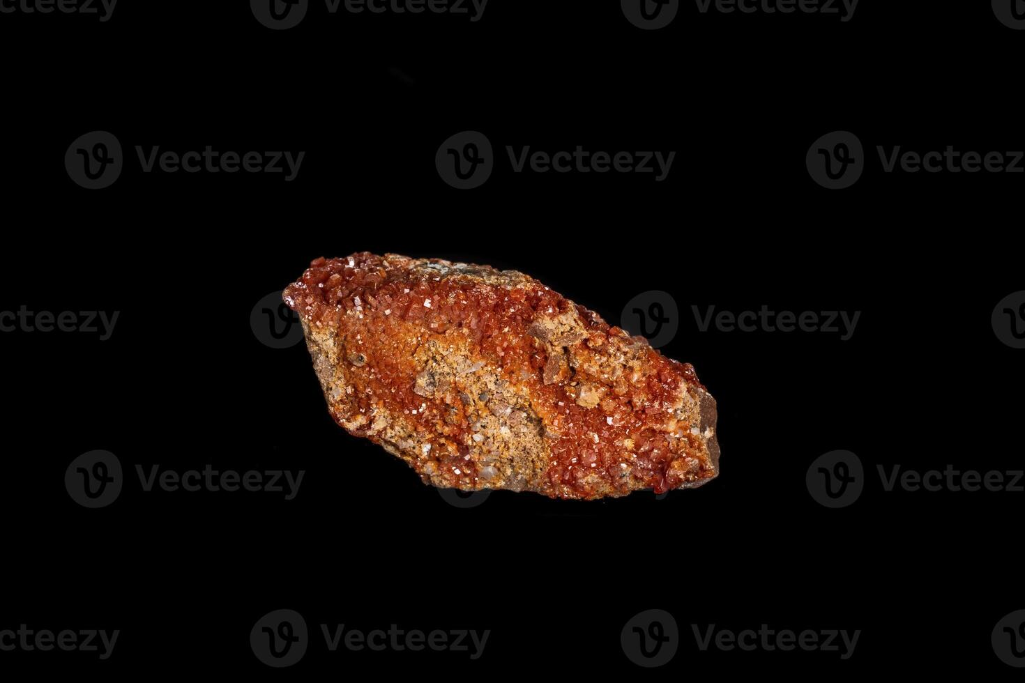 Macro mineral stone Vanadinite on a black background photo
