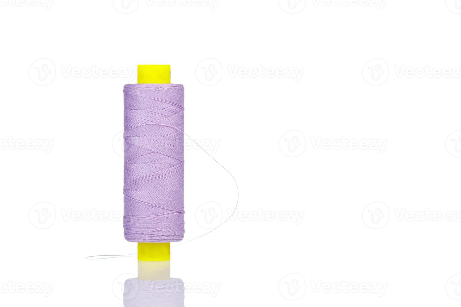 skein of thread purple colors macro on a white background photo
