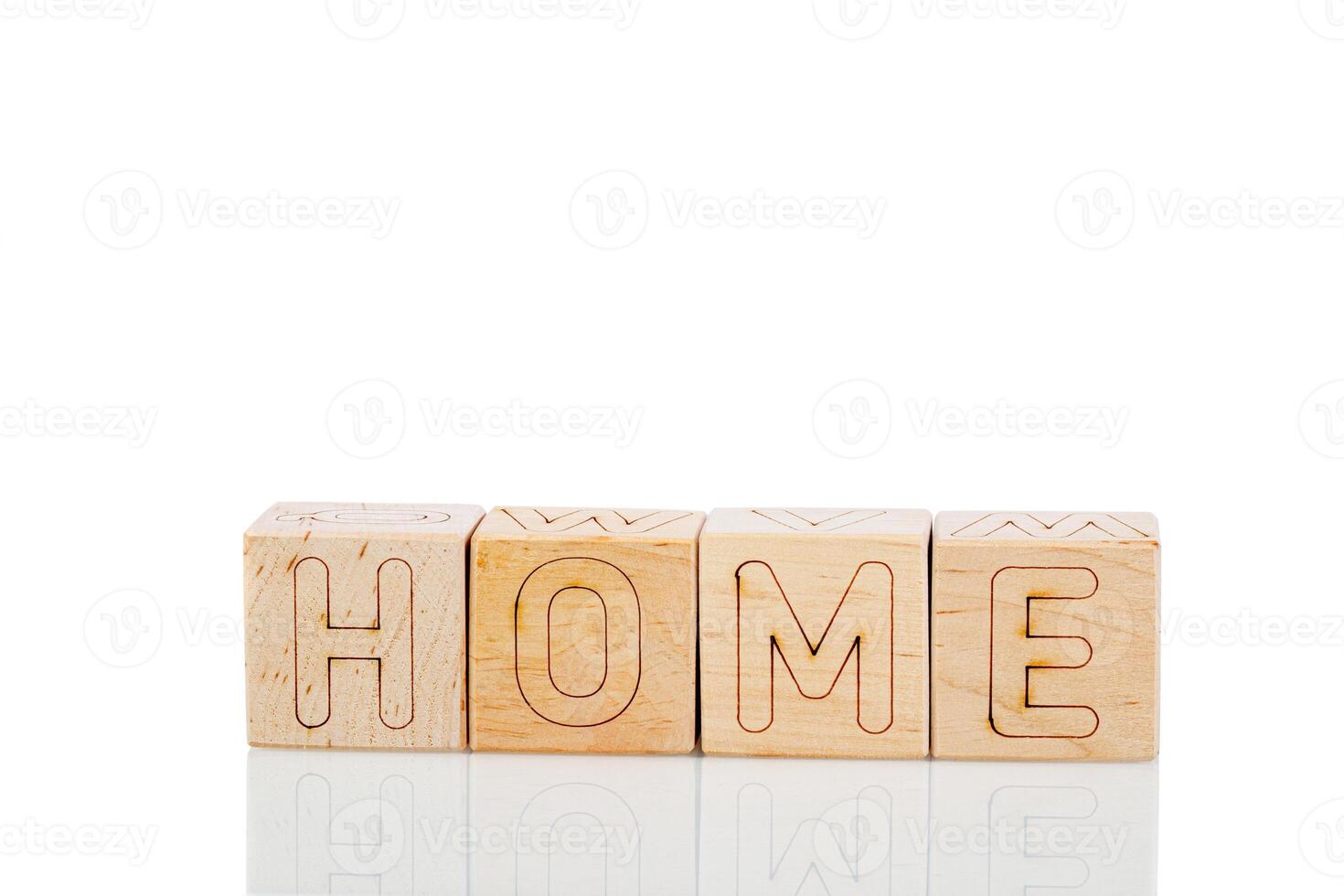 Wooden cubes with letters home on a white background photo