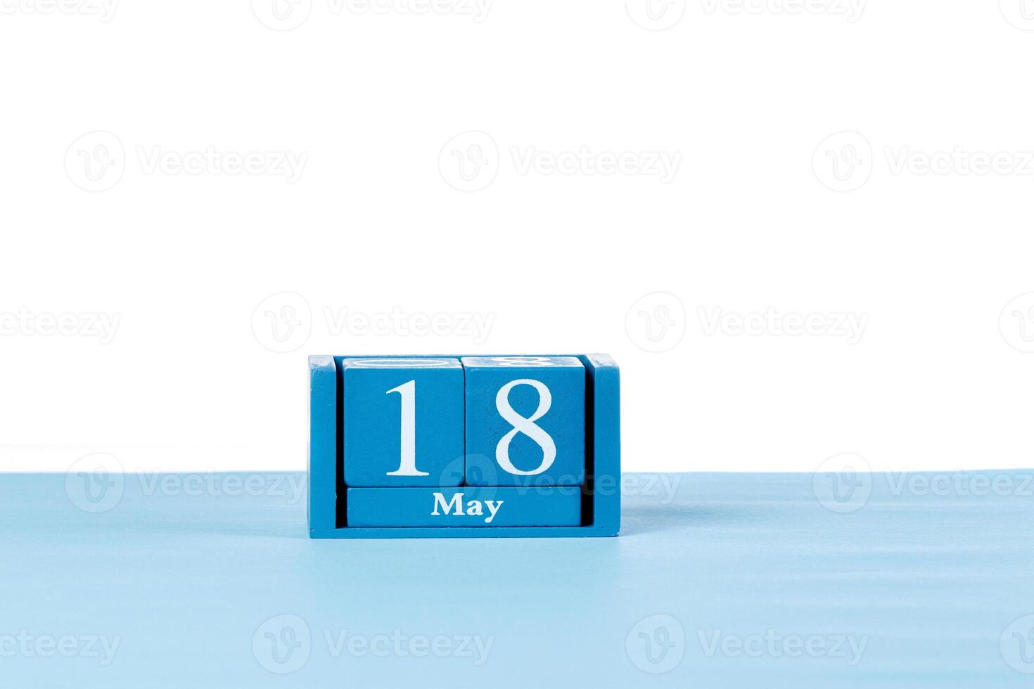 Wooden calendar May 18 on a white background photo