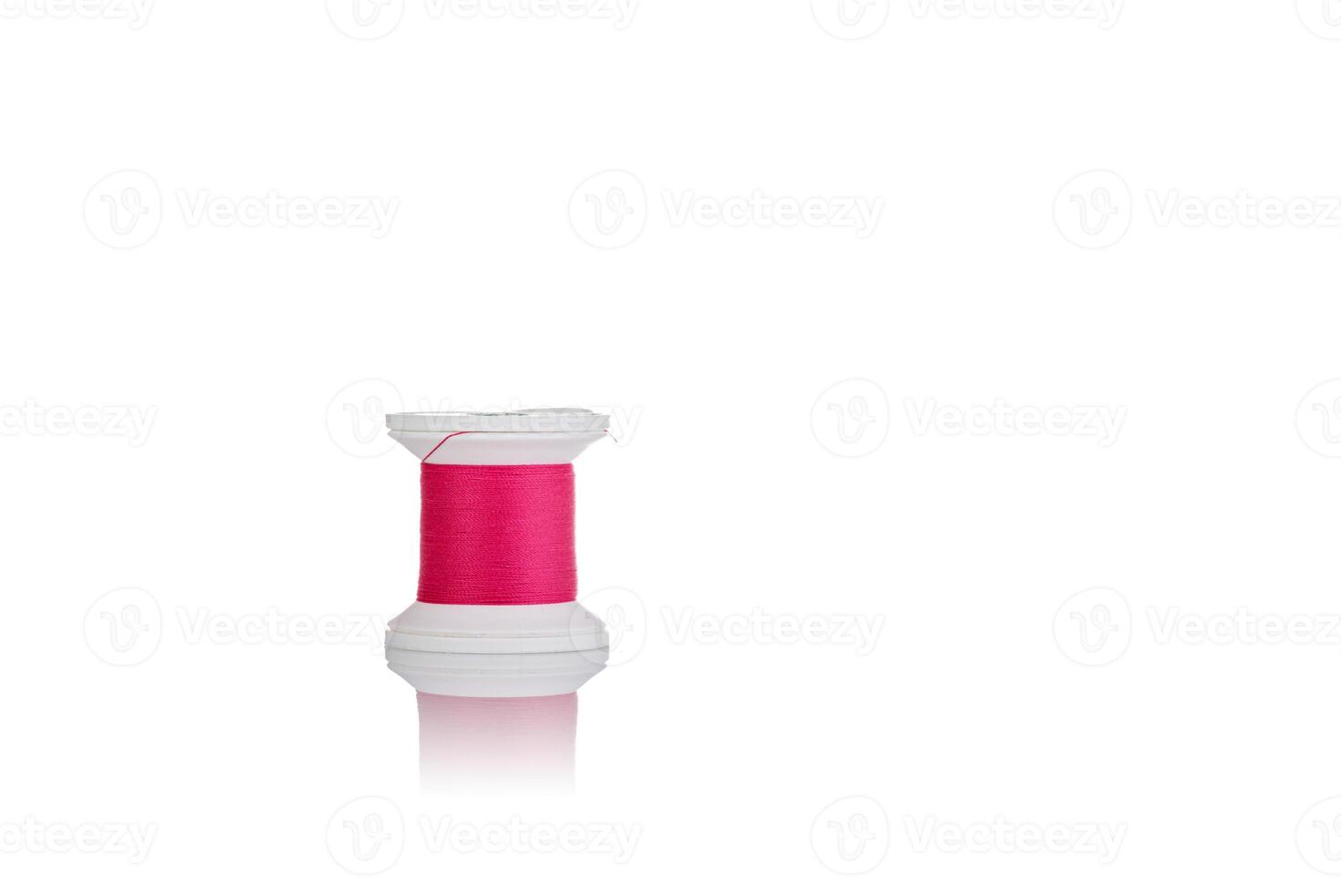 skein of thread pink colors macro on a white background photo