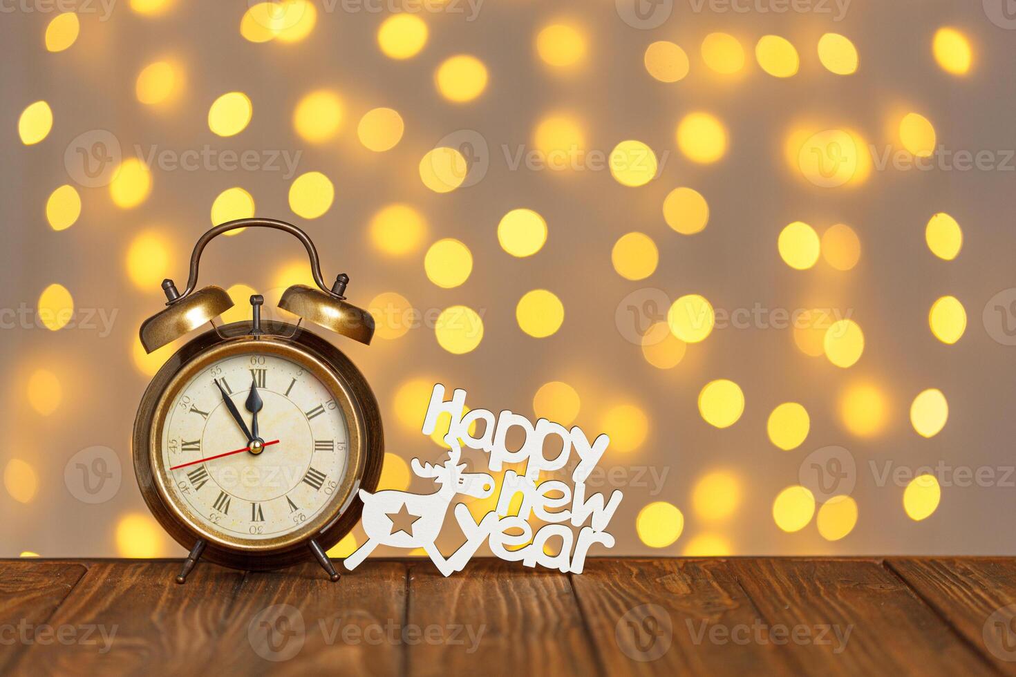 clock and the inscription Happy New Year on the background of blurry lights photo