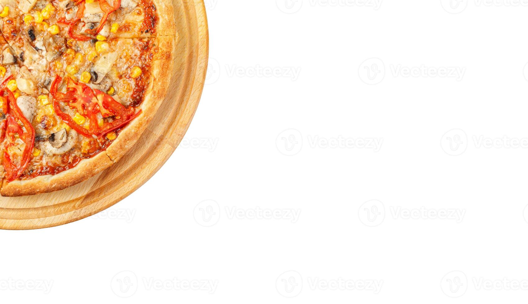delicious pizza with chicken, mushrooms, cheese, tomatoes and corn on a wooden background, on an isolated white background photo