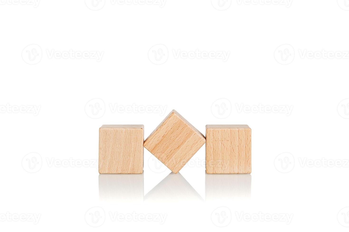 wooden cubes three 3 pieces on an isolate white background photo