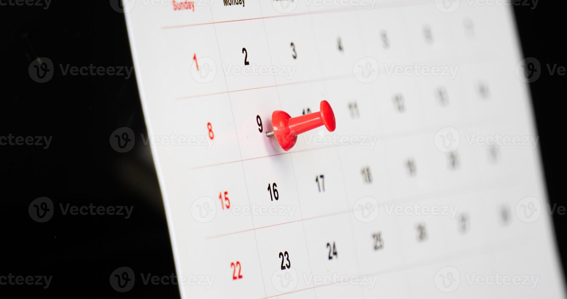 Important day with red pin on sitting calendar photo