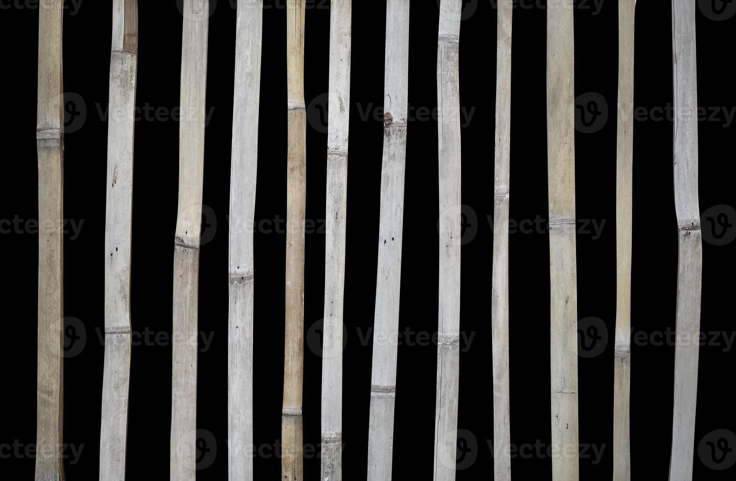 Bamboo fence isolated on black photo