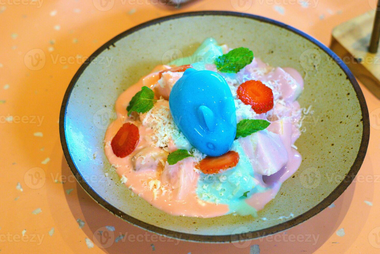 a bowl of fruit salad with yogurt and colorful pudding photo