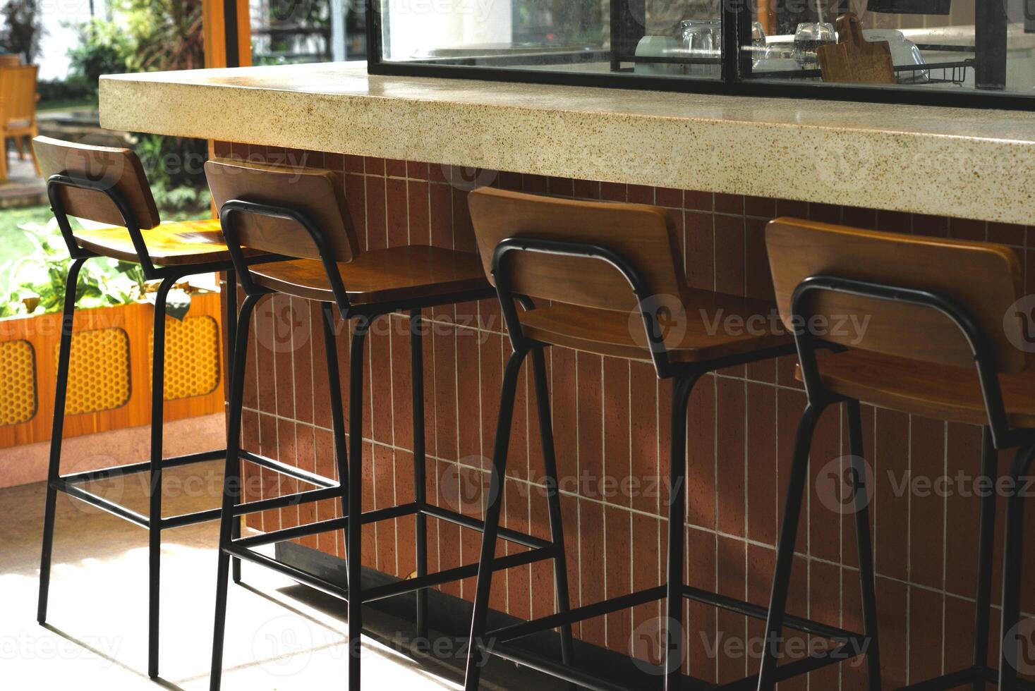 tables and row of chairs in a restaurant photo