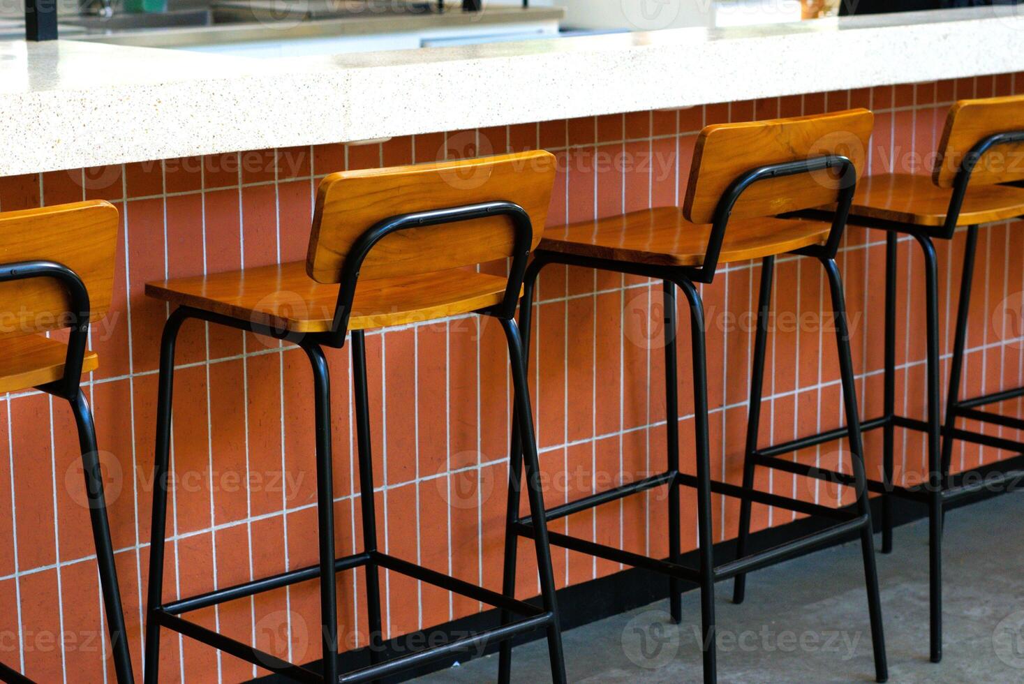 rows of wooden chairs in a cafe photo