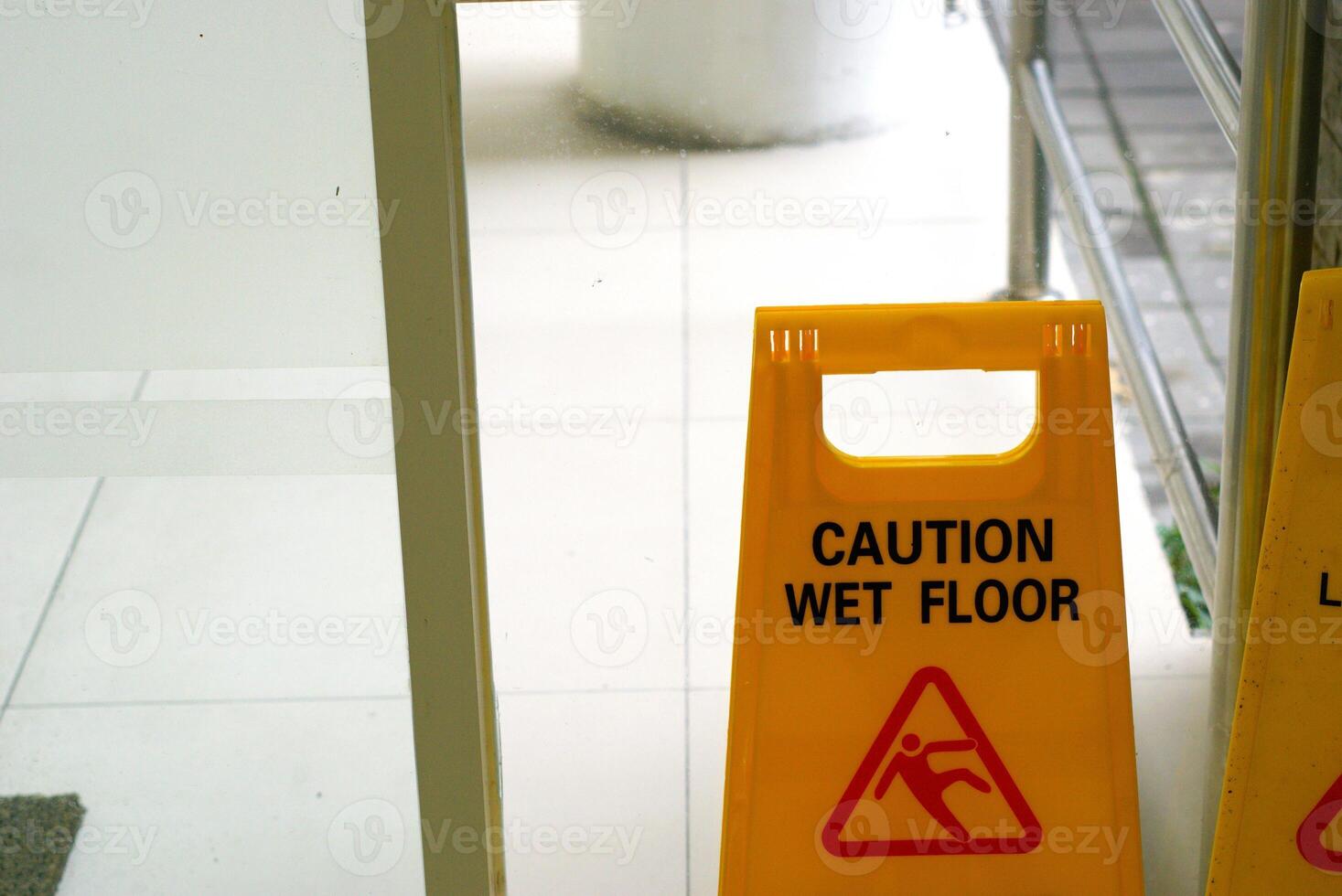 caution wet floor sign in a public building photo