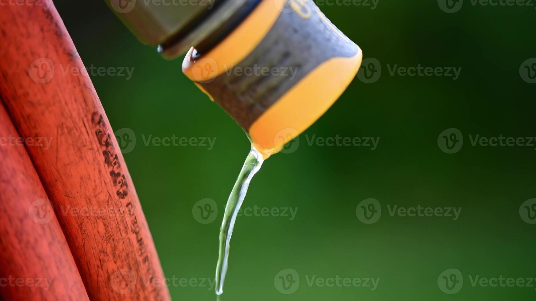water dripping from hose, gardening, watering plants, saving water, with copy space photo