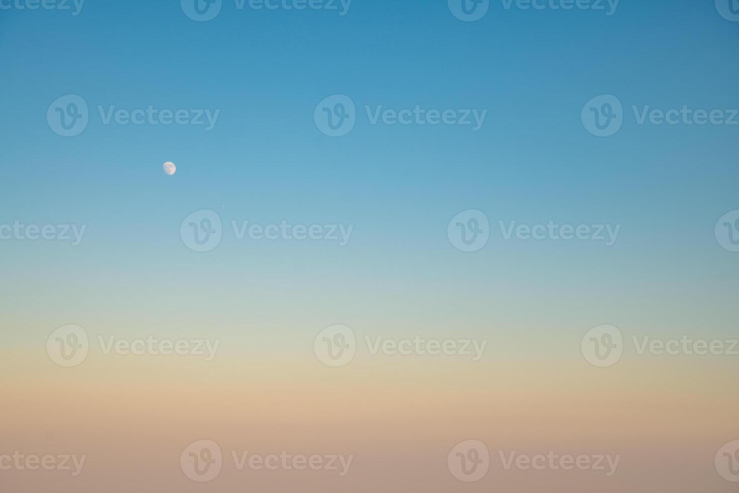 moon in the sky, Natural background, sky at sunrise or sunset, color gradient from pink orange to blue, delicate and smooth transition photo