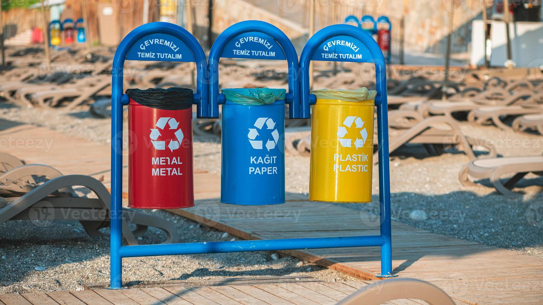 containers, trash bins for separate waste on the beach, waste recycling, environmental protection photo