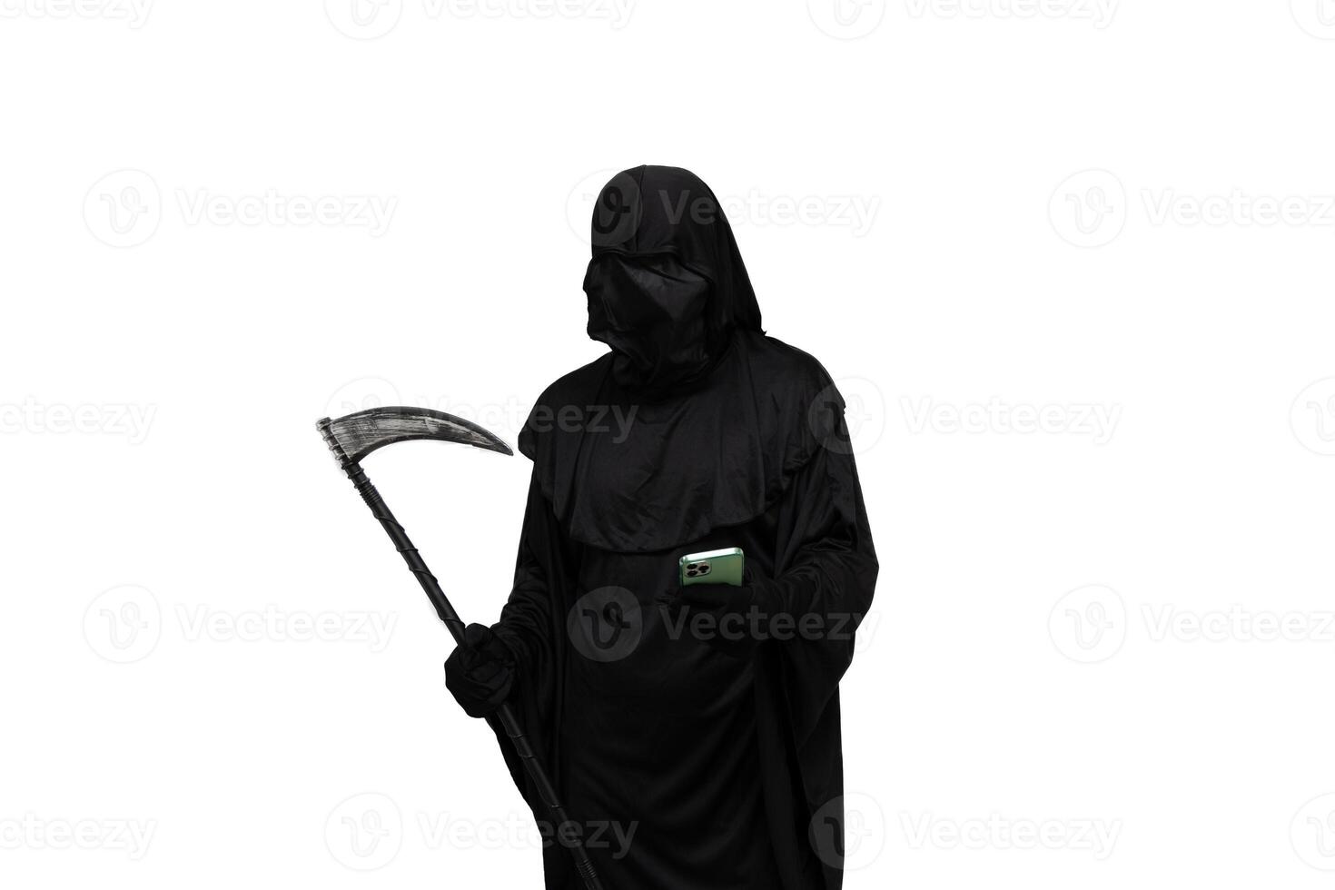 Grim reaper in Halloween costume holding scythe and texting on smartphone white background photo
