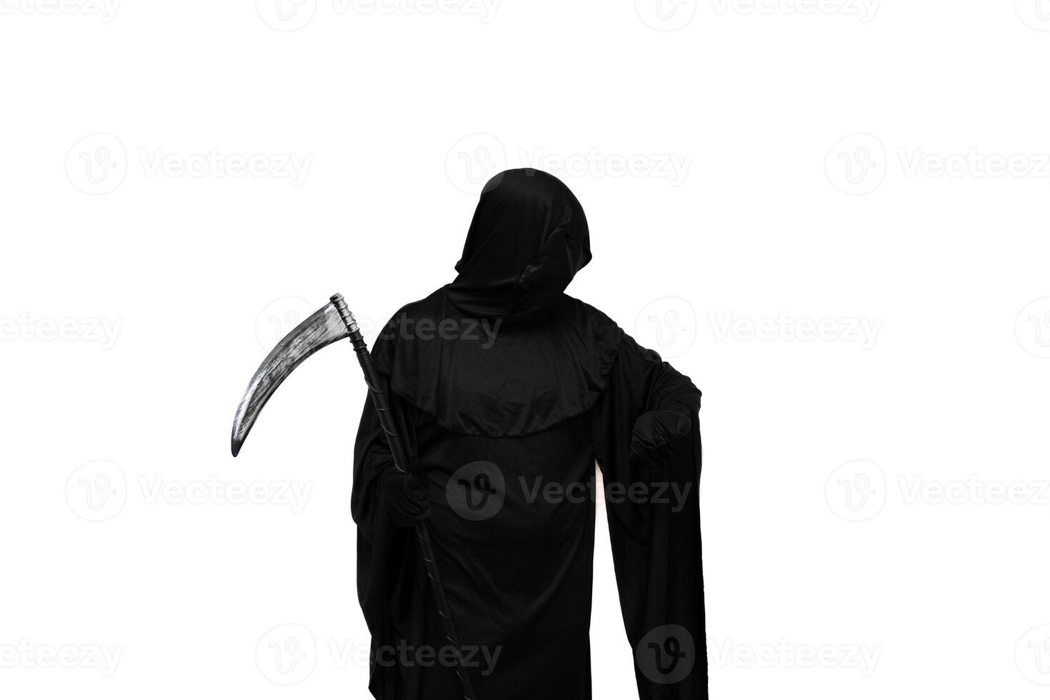 Grim reaper in Halloween costume holding scythe and impatiently checking wristwatch photo