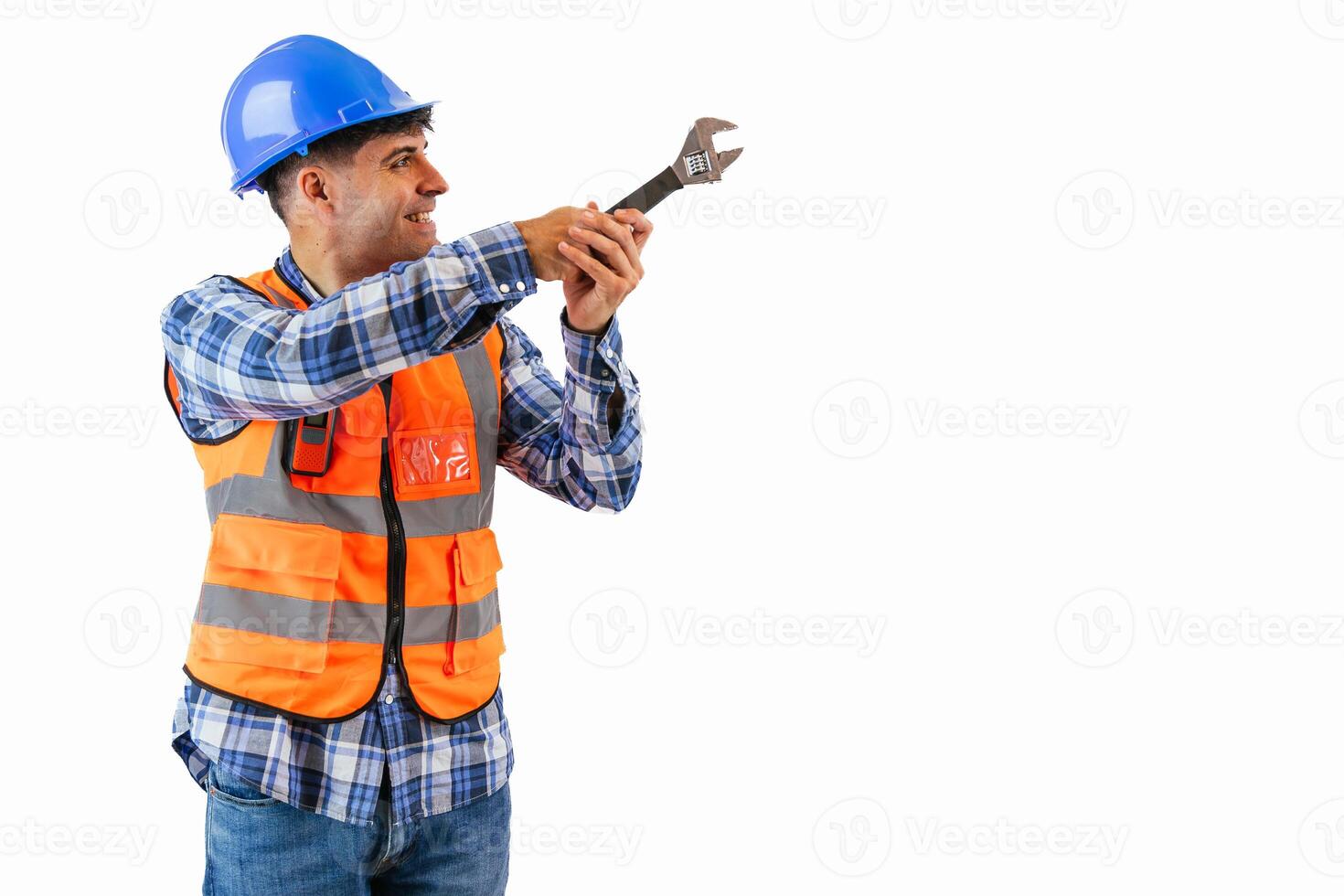 copyspace Construction worker tightening a screw with a wrench in safety gear white background photo