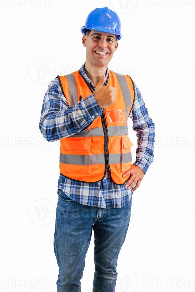 vertical Triumphant construction worker giving a thumbs-up wearing orange vest and safety helmet photo