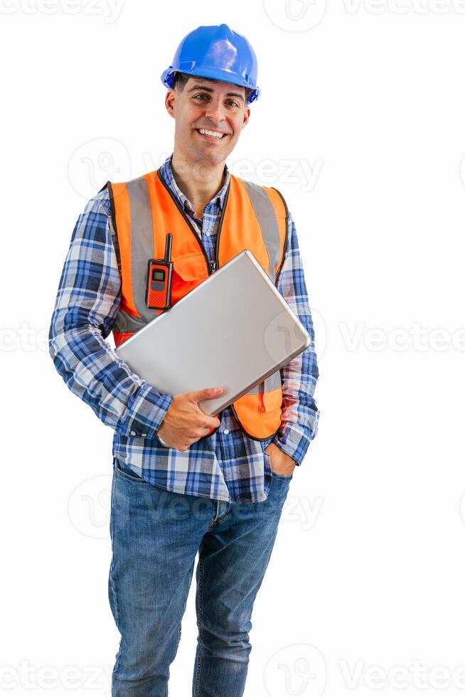 vertical Engineer holding his laptop while looking at camera wearing orange vest and safety helmet photo